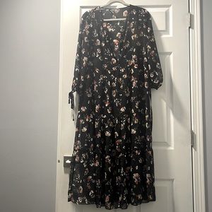 Beautiful flowy dress adorned with a pretty floral pattern